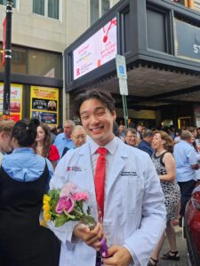 Andrew Jung holding flowers