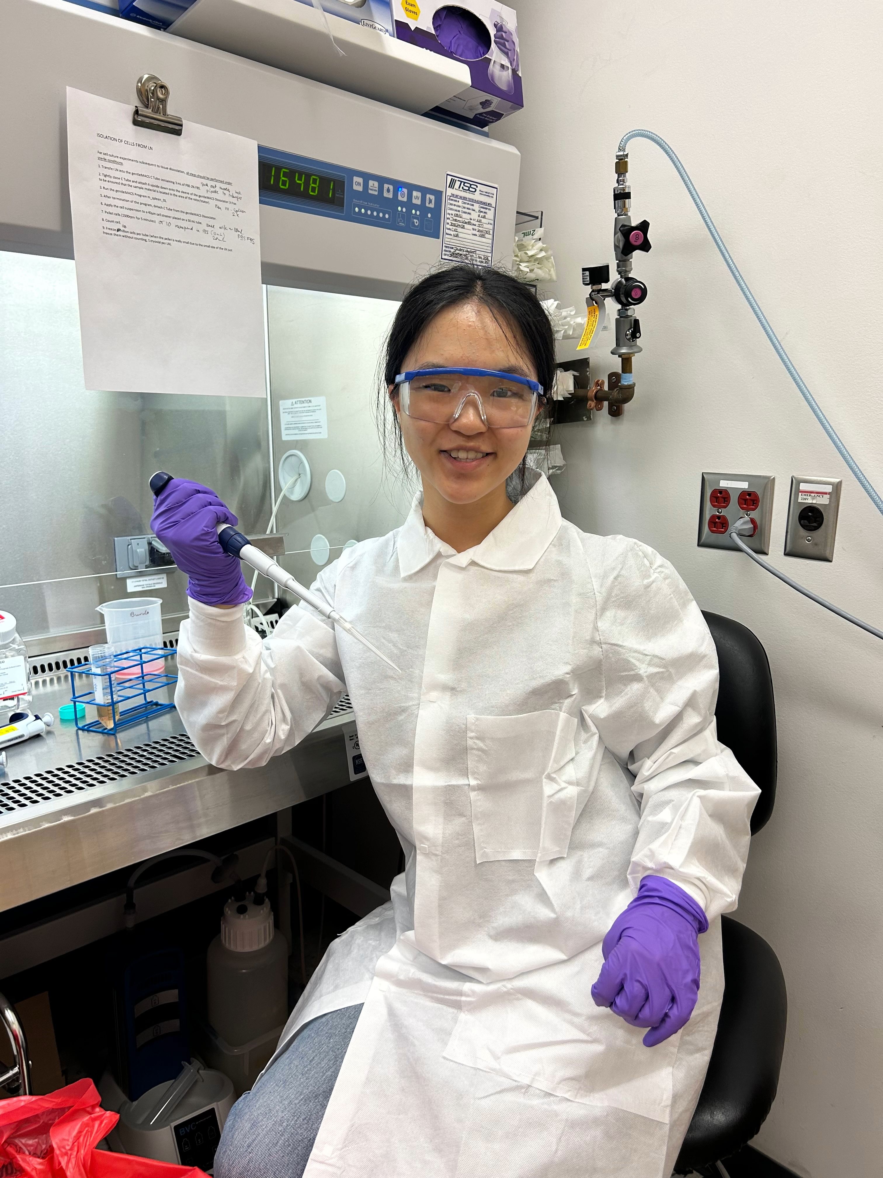 Chloe Lee smiling in the lab