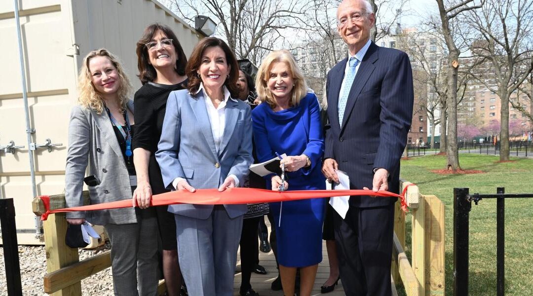 Governor-Kathy-Hochul-center-at-a-ribbon-cutting-ceremony-for-teh-new-Astoria-Houses-facility-Courtesy-of-Kevin-P.-Coughlin-Office-of-Governor-Kathy-Hochul_0