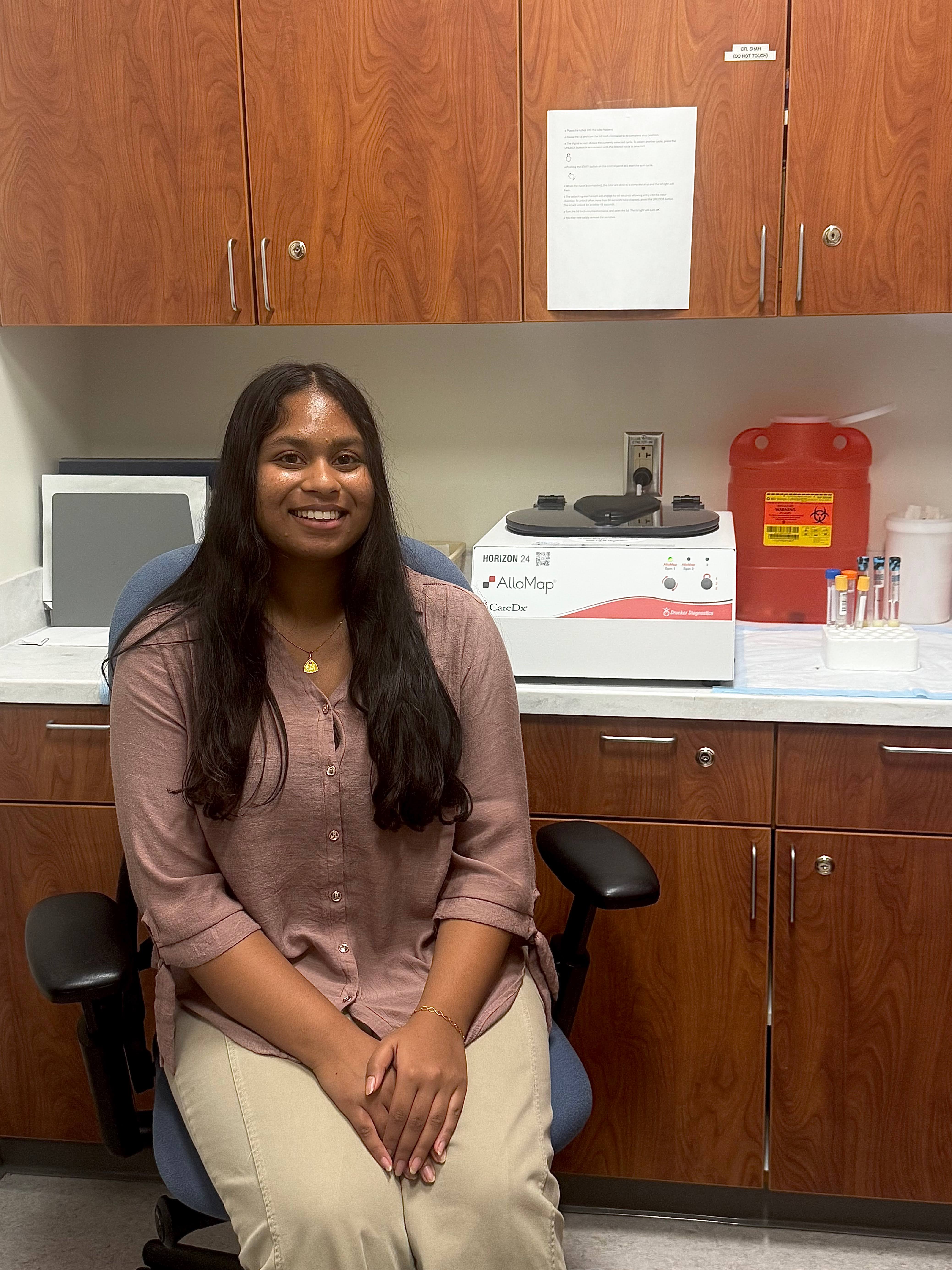 Samadhi Ranaweera in the lab, hand folded
