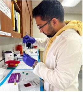 Sidharth Patel at lab bench working