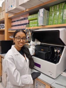 Therese Juse smiling in the lab