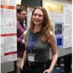 Trainee Standing by Poster Presentation